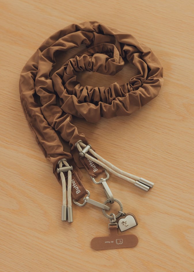 奶油捲捲手機背帶