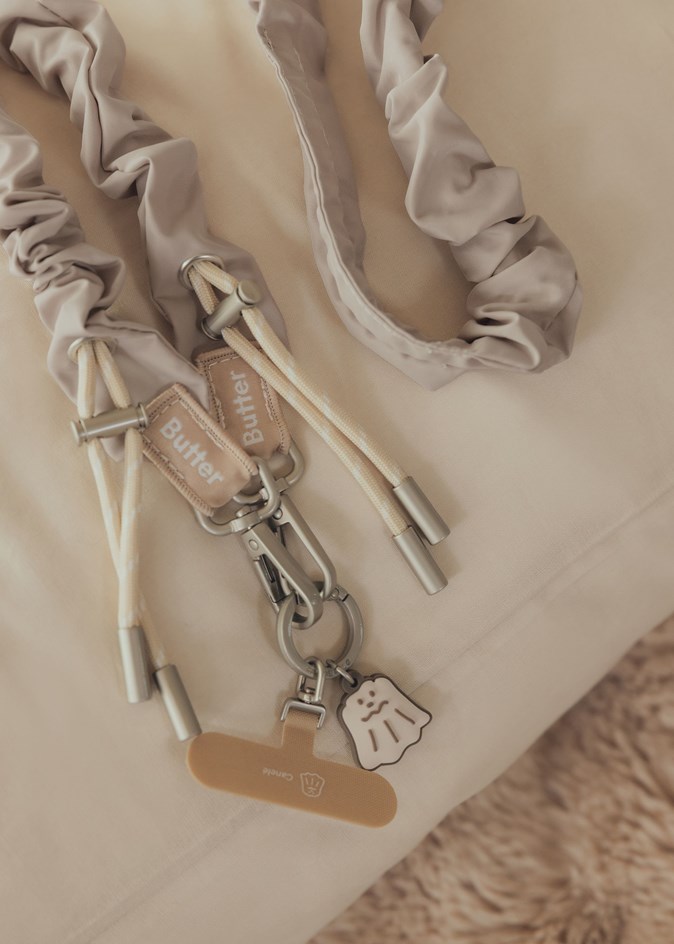 奶油捲捲手機背帶