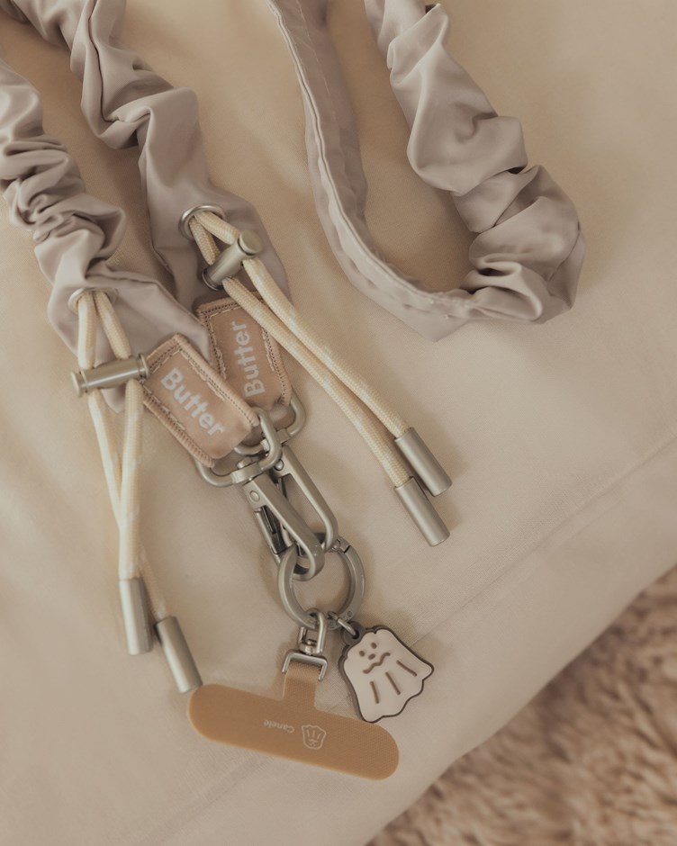 奶油捲捲手機背帶